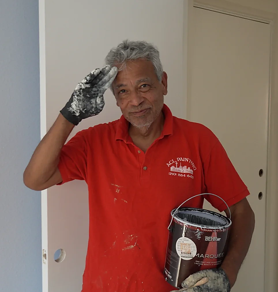 Michael Ramirez, owner of A.C.L. Painting, giving a friendly salute on a job site